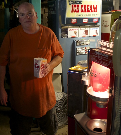 Larry next to Coke Machine